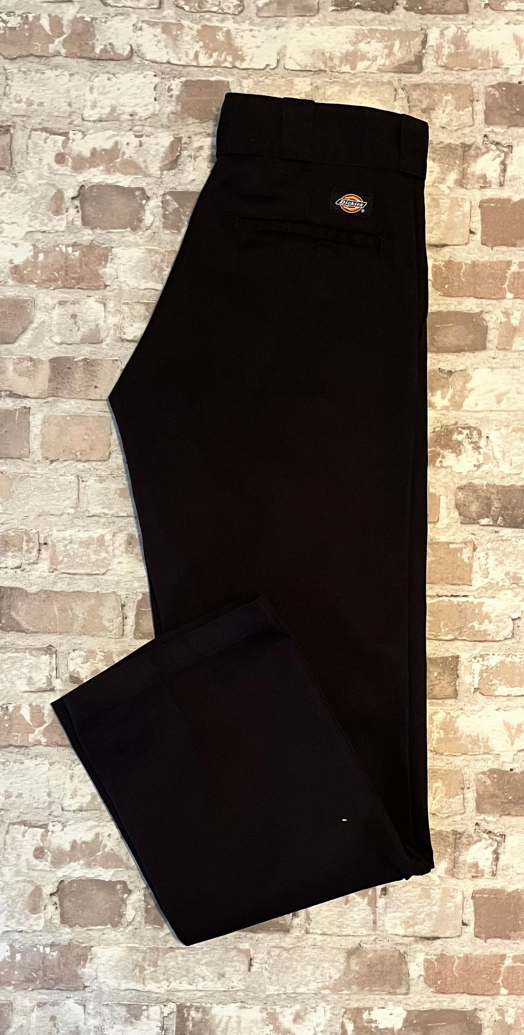 Pantalon de travail Dickies 874 Original Fit noir rigide à pli permanent, présenté plié à plat.