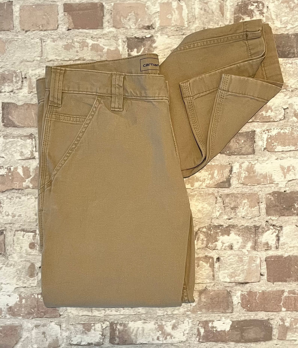 Pantalon de travail beige tan Carhartt Rugged Flex en toile canvas stretch, présenté à plat