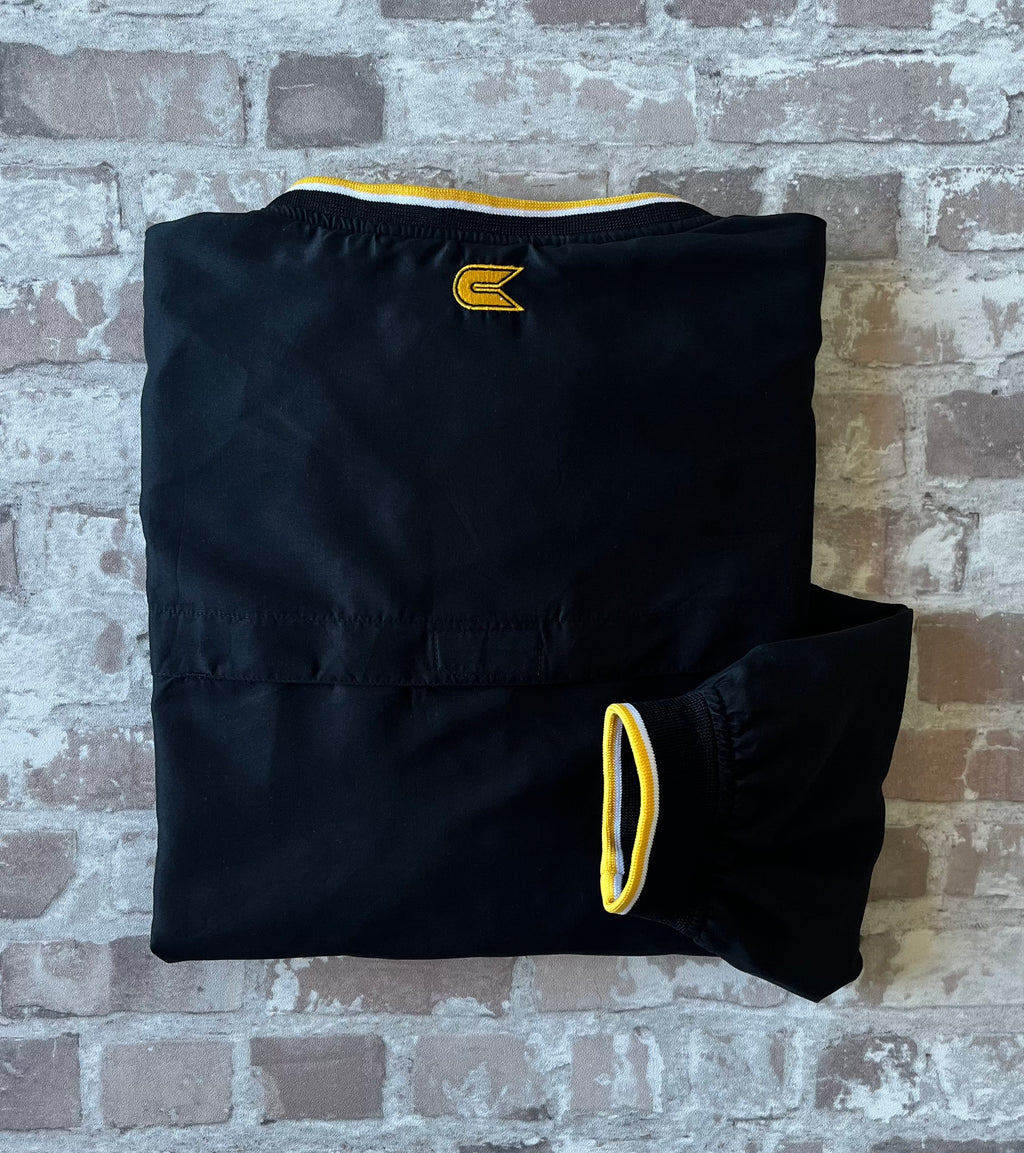 Veste de sport pullover vintage Colosseum Athletics noire avec broderie jaune Mizzou et col en V tricolore, présentée pliée à plat, vue de dos
